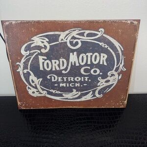 Ford Motor Co. historic logo metal tin sign.